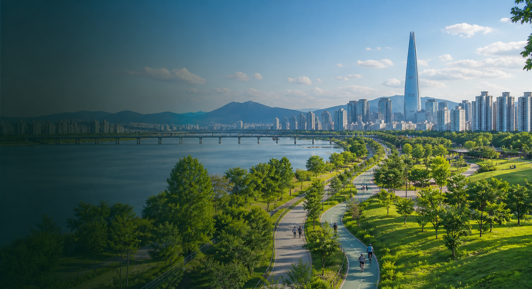 Seoul city skyline with riverfront greenspace, walking paths, and urban parkland.